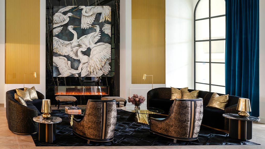 A living room with a large painting.