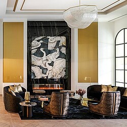 A room with a large painting.