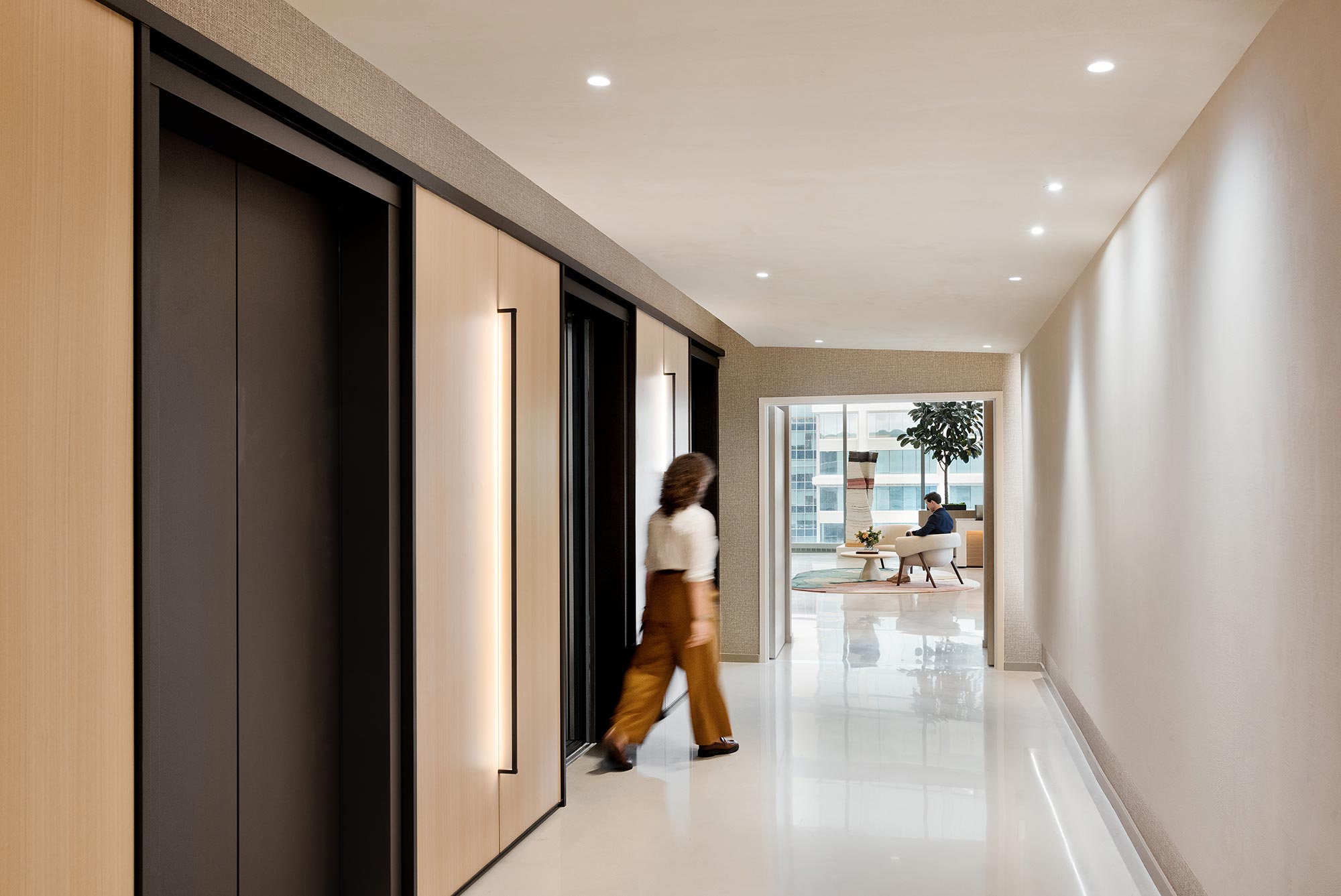 A person walking through a hallway.