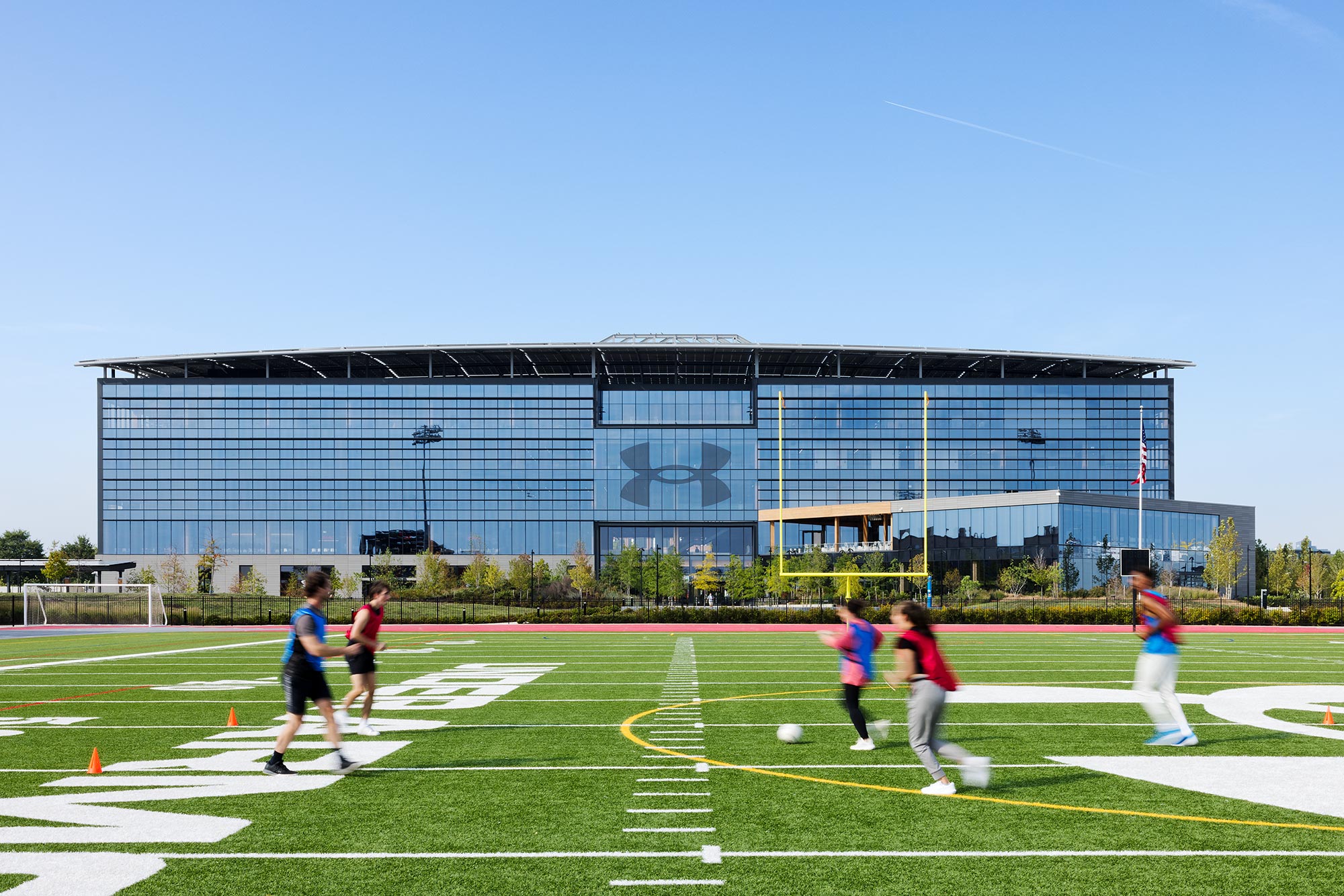 A group of people playing football.