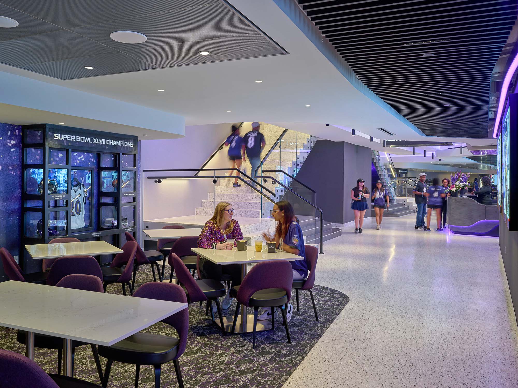 People sitting at tables in a building.