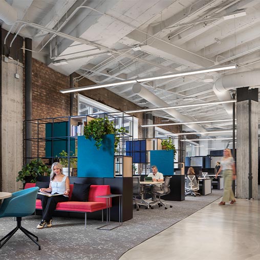 A person sitting on a red couch.