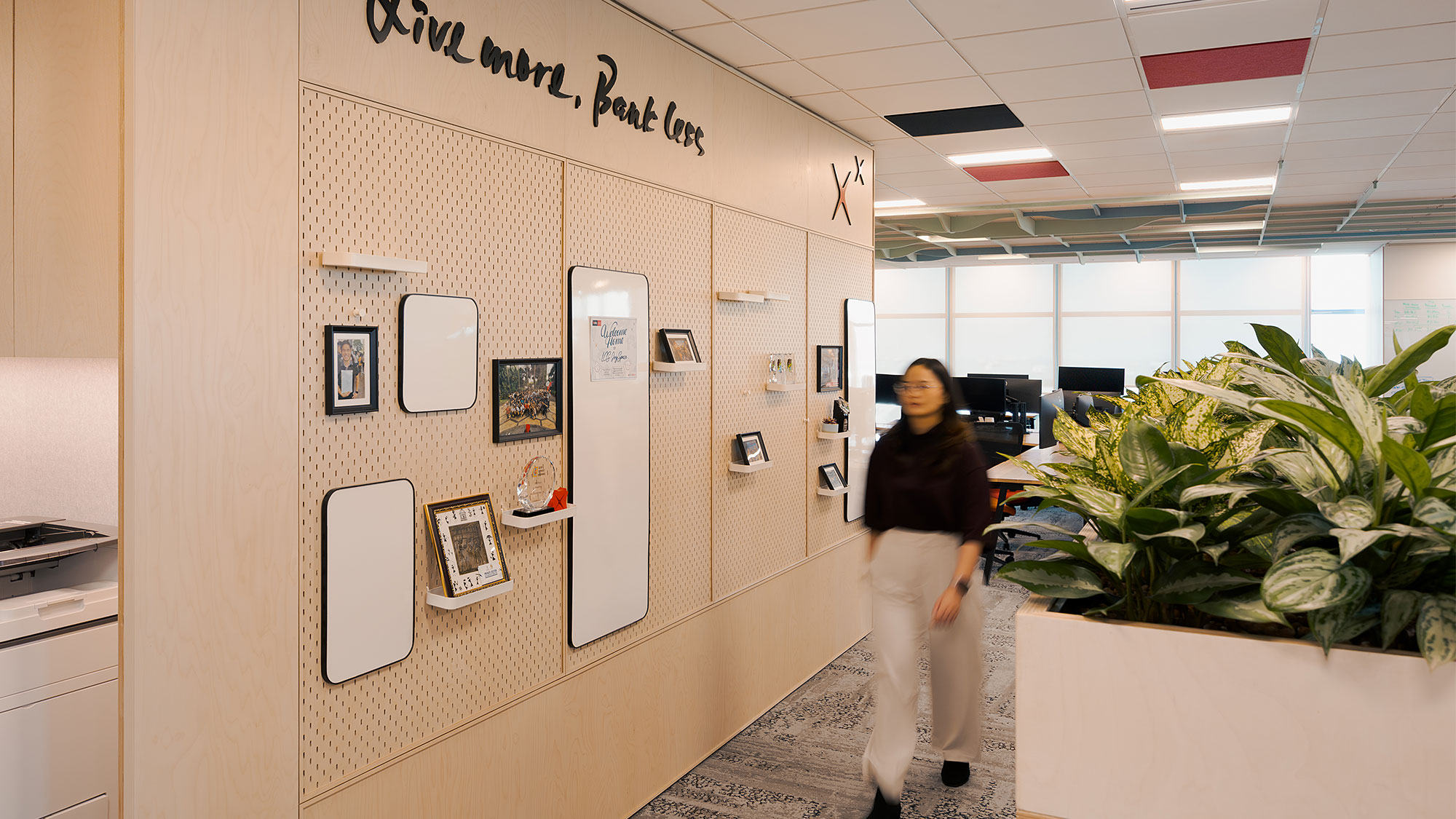 A person standing in a hallway.