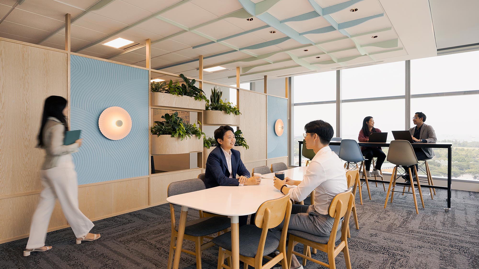 A group of people sitting around a table.