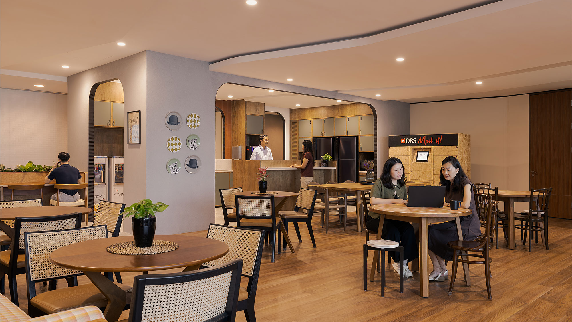 A group of people sitting at tables.