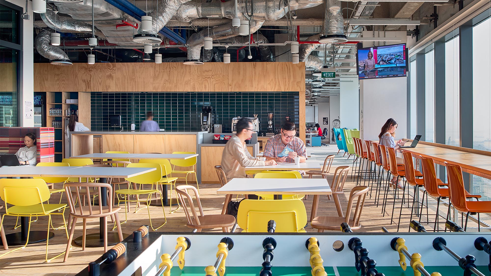 A group of people sitting at tables.