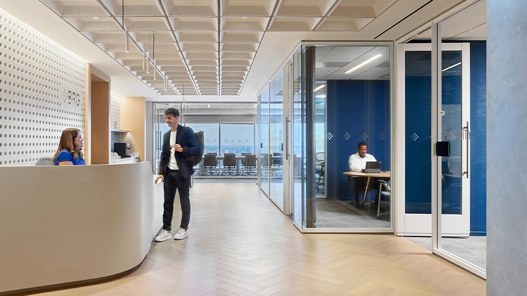 A man and a woman in an office.