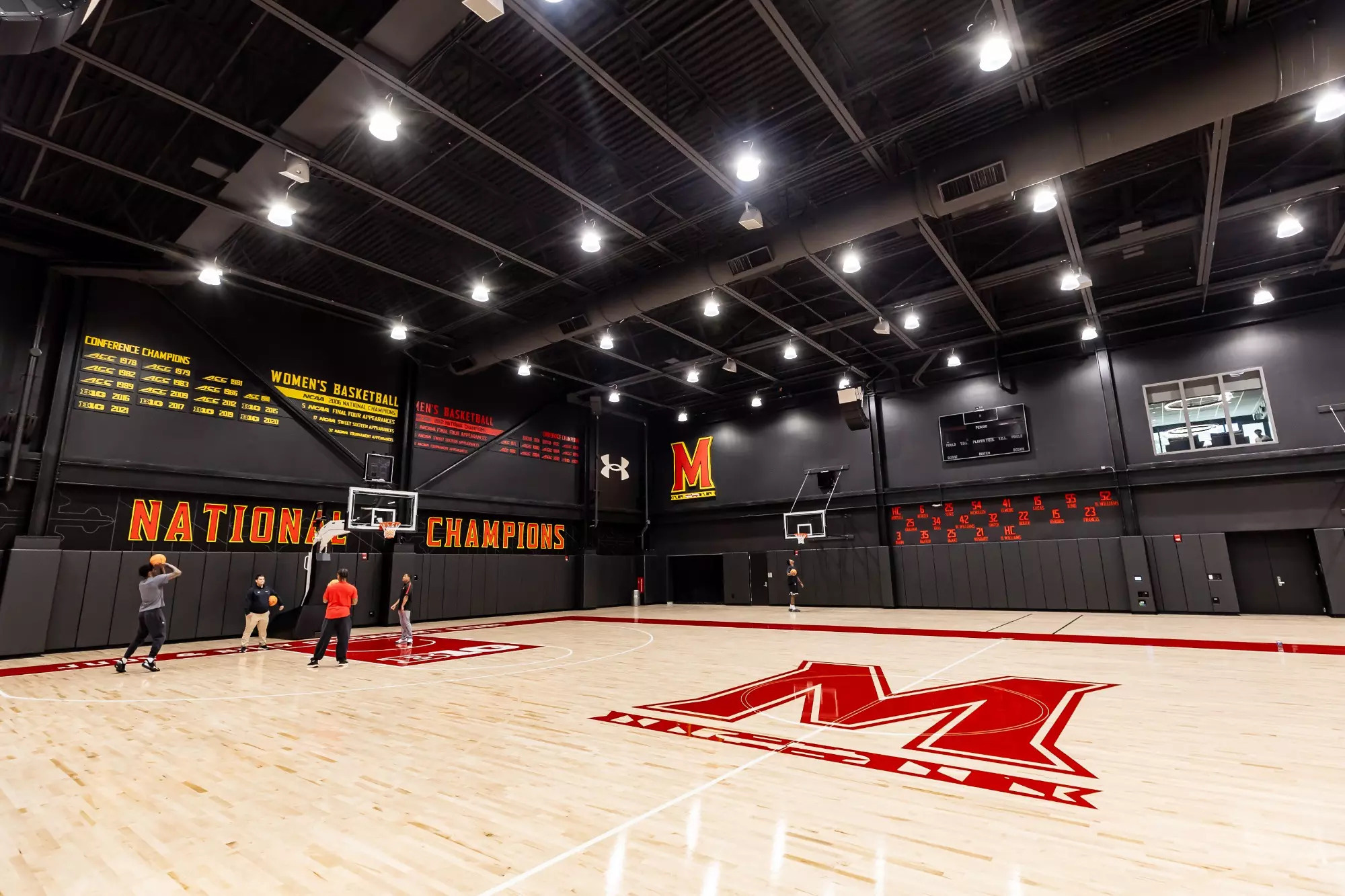 A group of people playing hockey.
