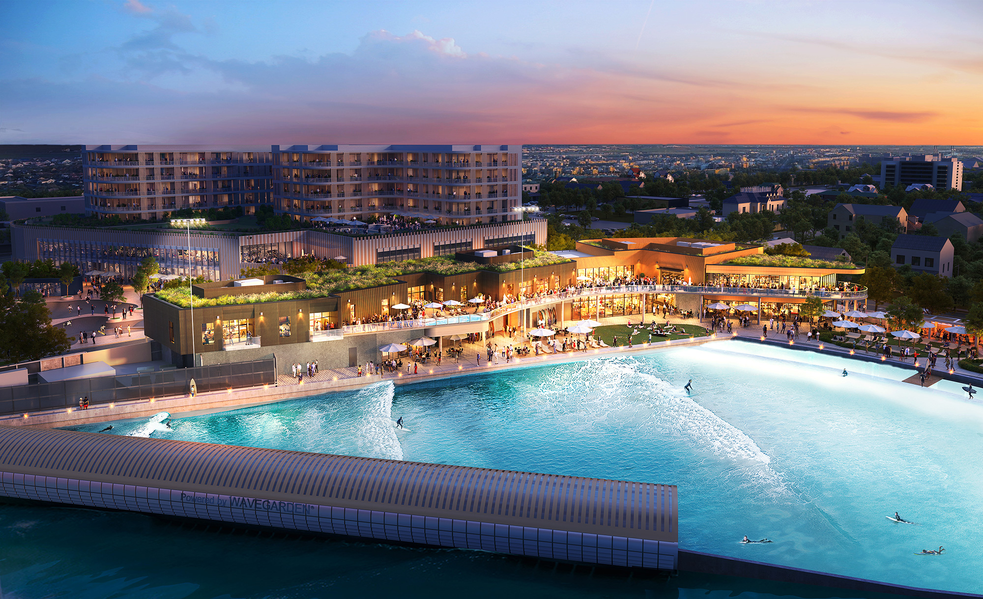 A pool with people in it by buildings and a sunset.