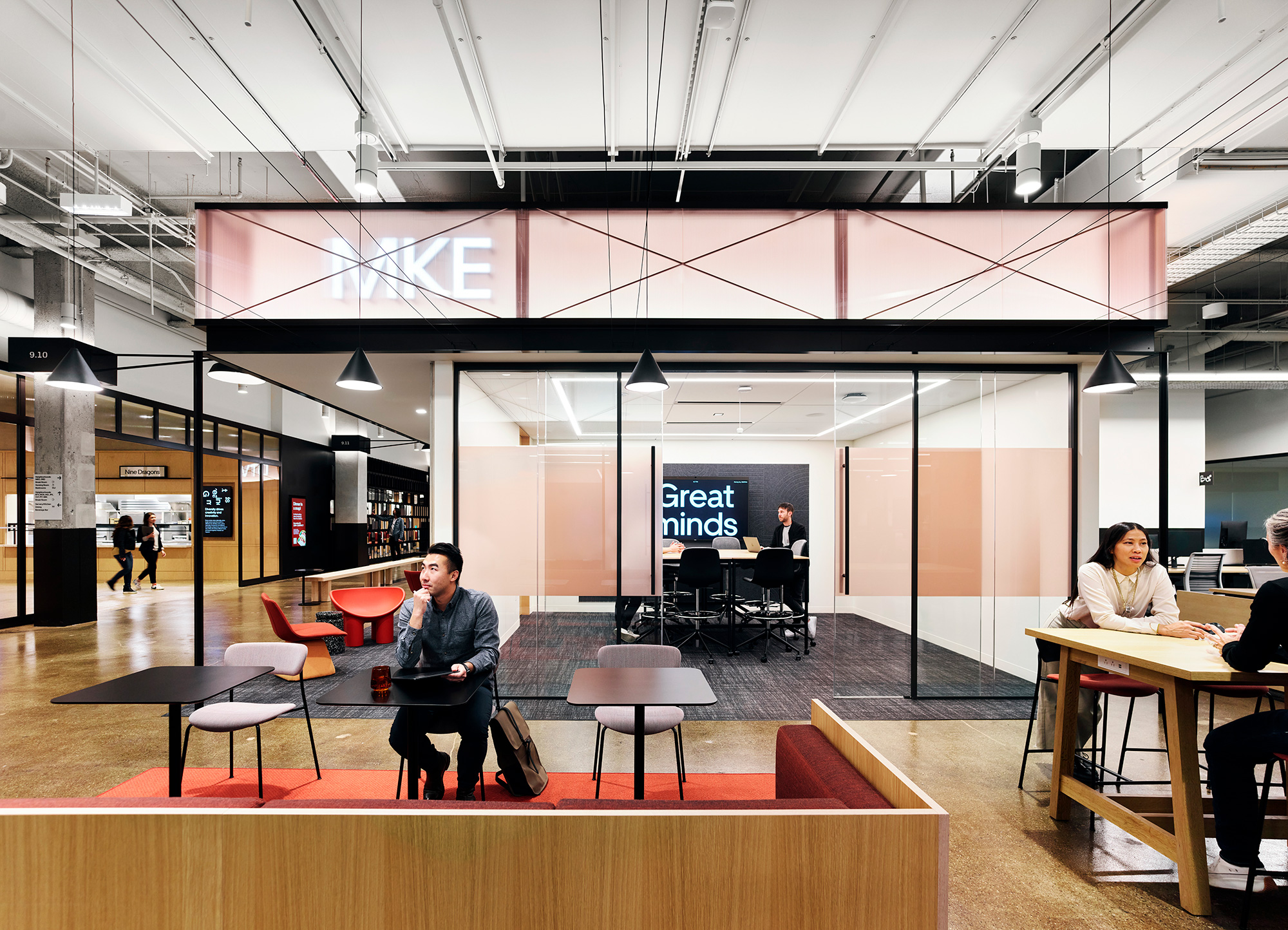 A group of people sitting at tables.