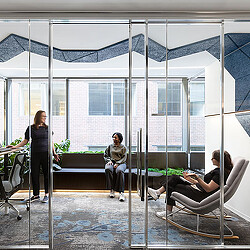 A group of people sitting in chairs.