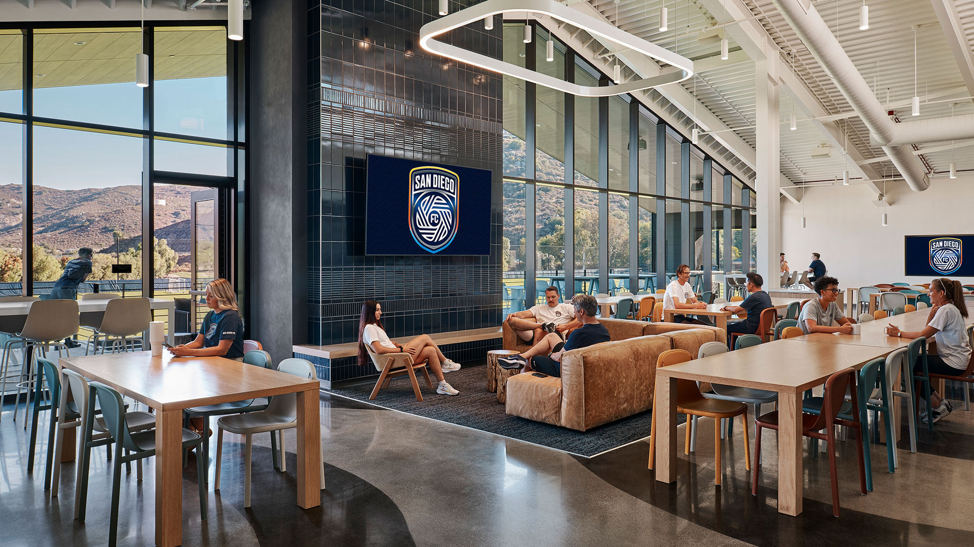 A group of people sitting at tables.