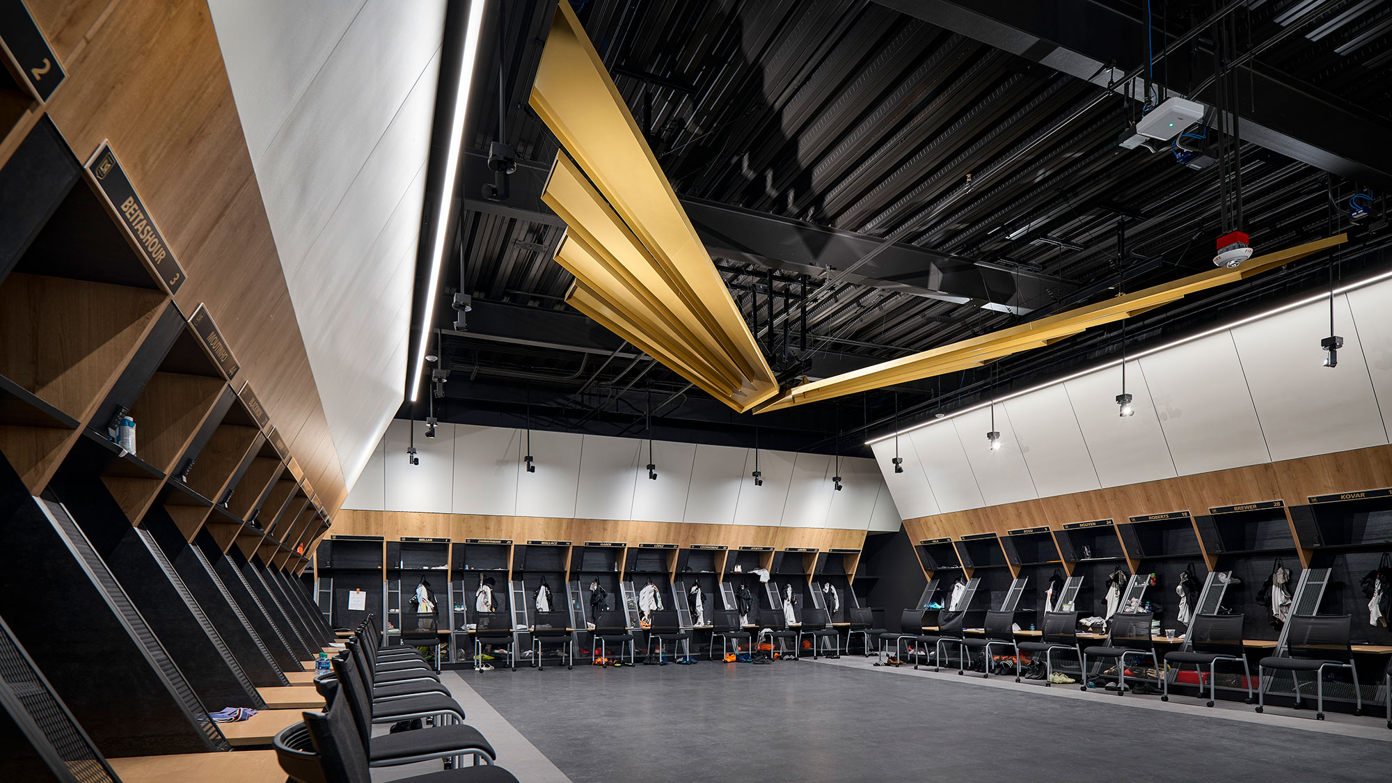 A large room with a stage and chairs.