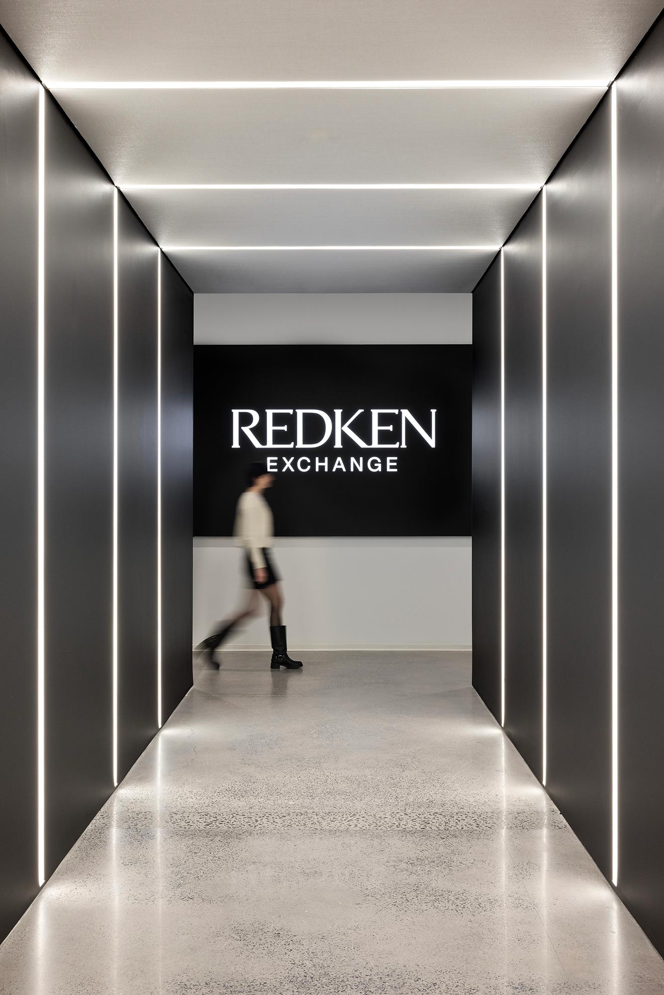 A person walking through a hallway.