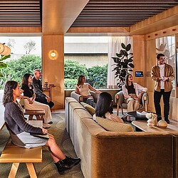 A group of people sitting in a room.