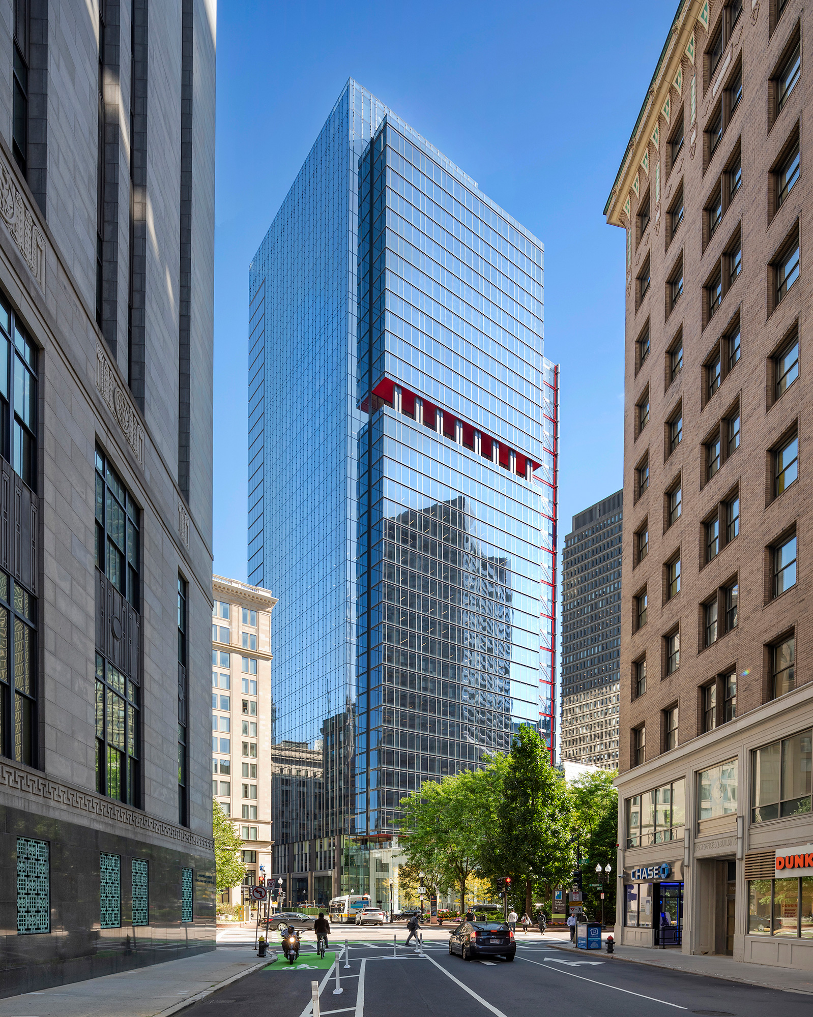 A street with tall buildings on either side of it.