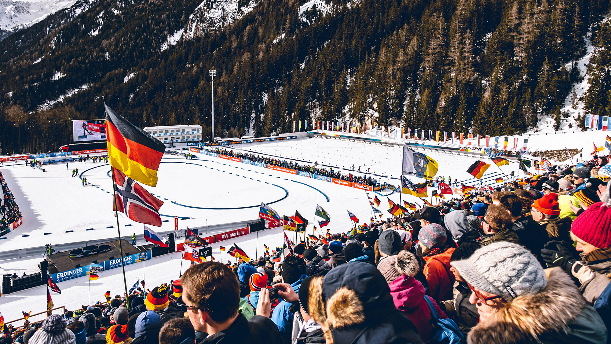 A crowd of people at a ski resort.