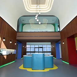 A room with a green ceiling and blue and white circular objects.