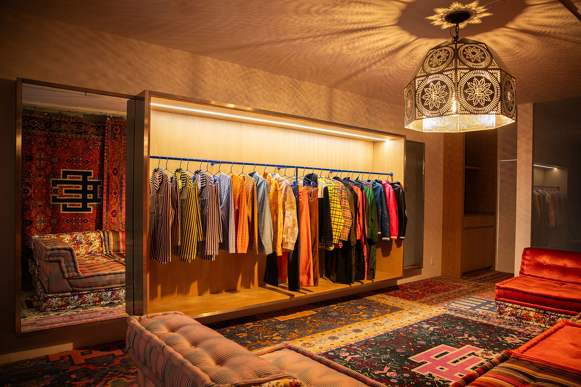 A room with a bed and a chandelier.