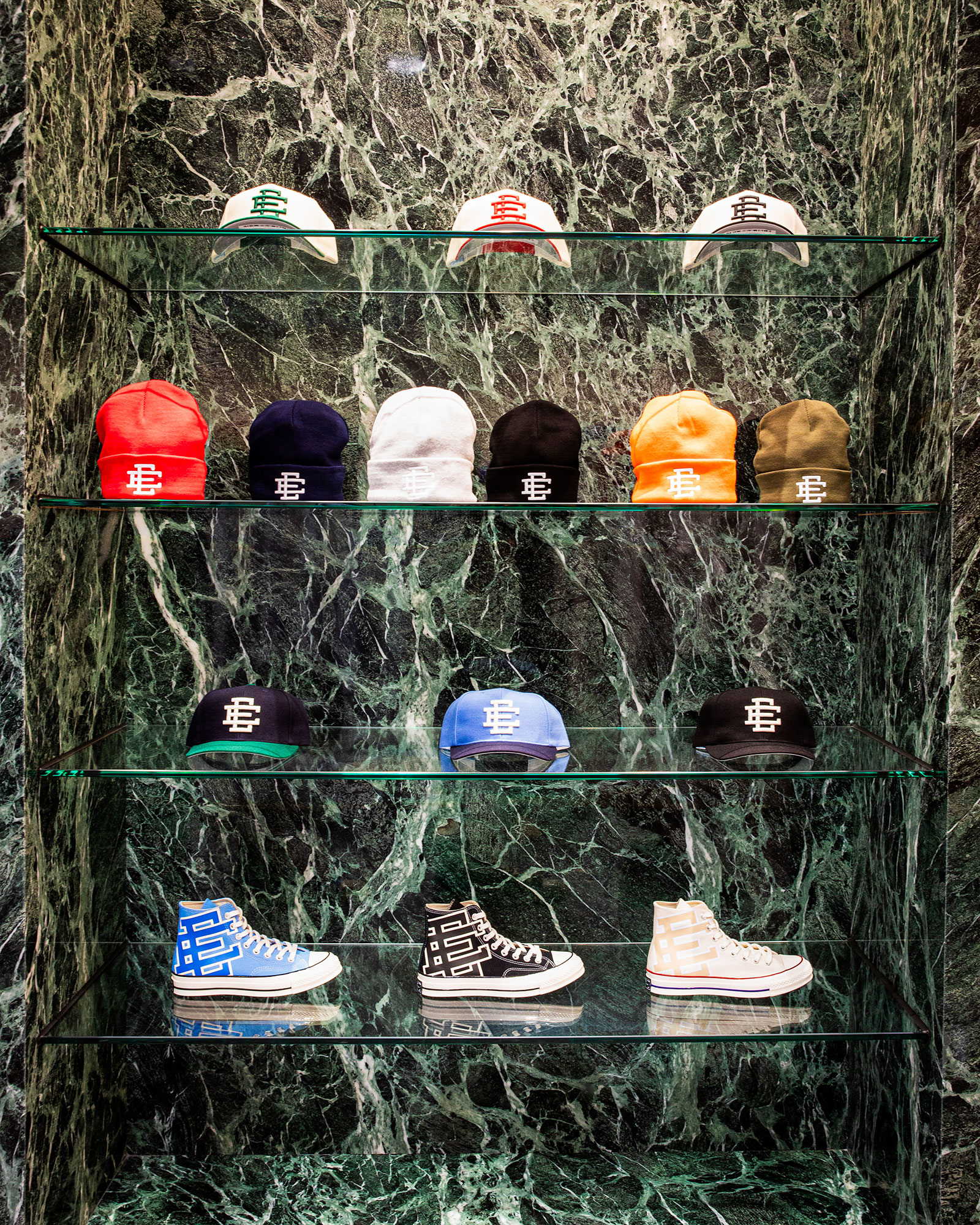 A group of shoes on a tree.