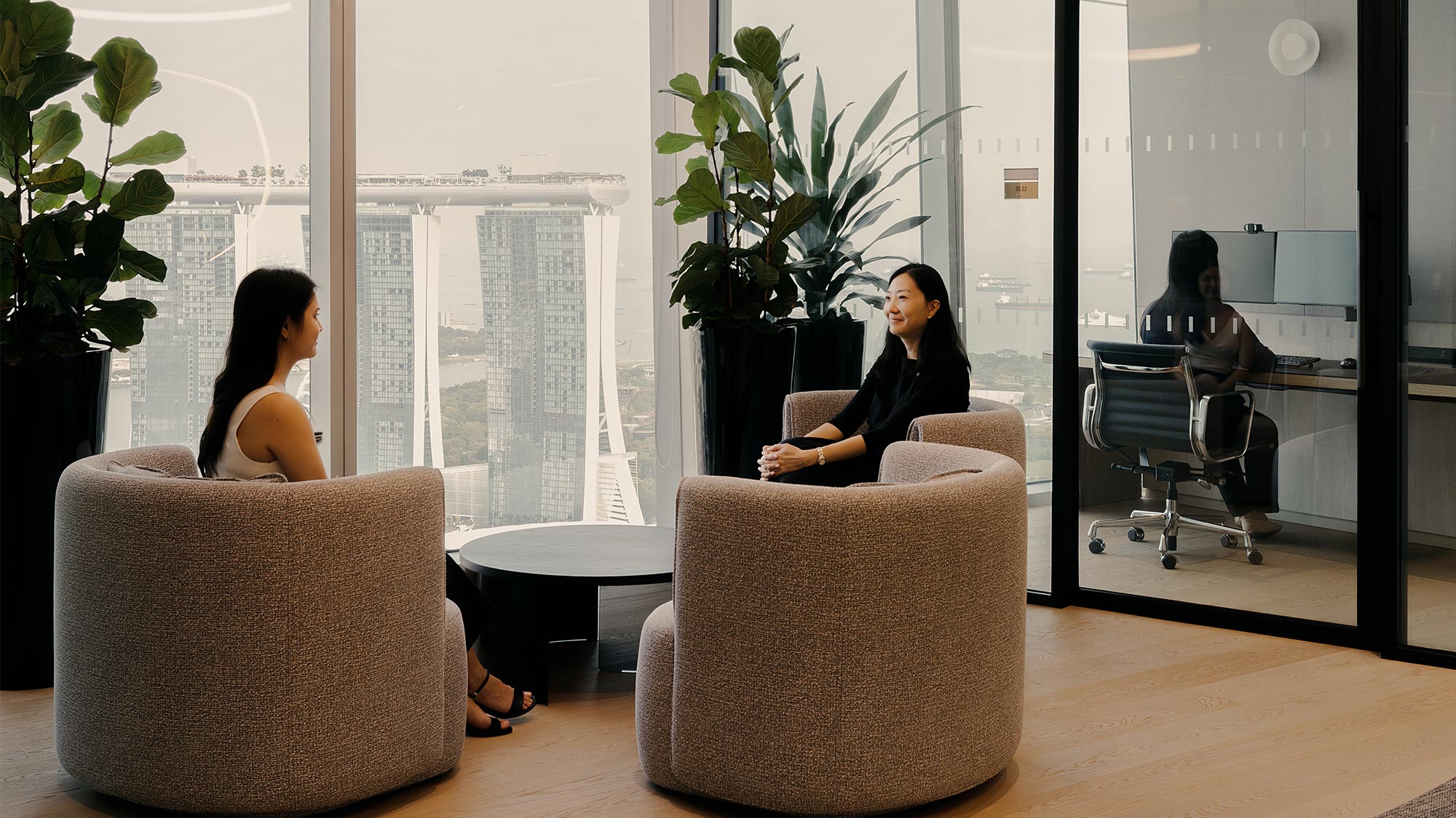 A group of women sitting in chairs.