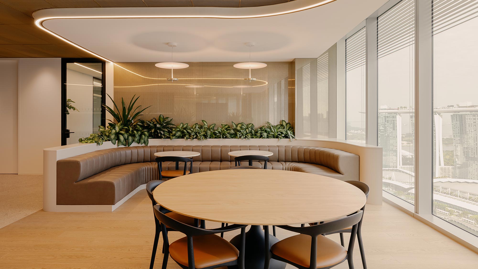 A room with a table and chairs.