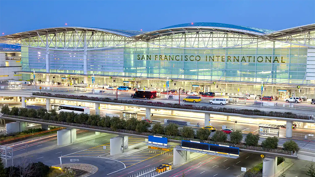 A large stadium with a large glass roof.