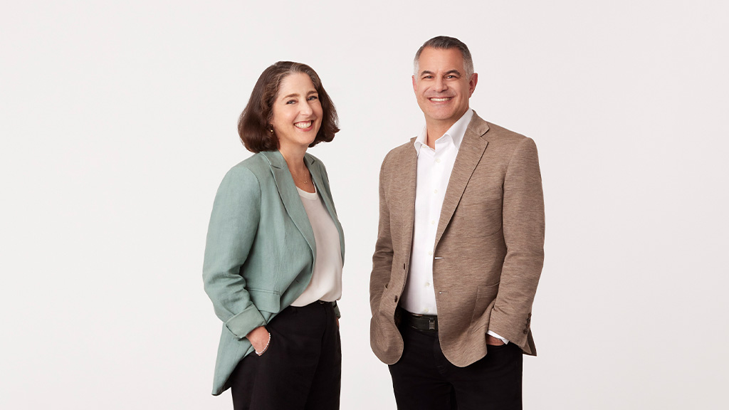 A man and a woman smiling.