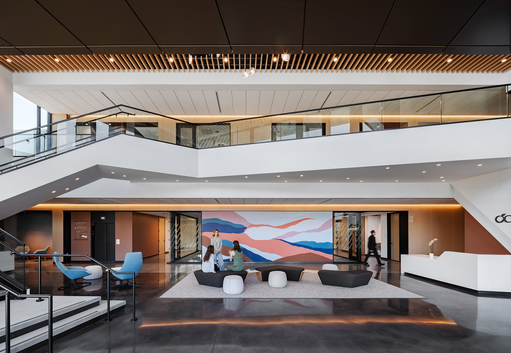 A large room with a large painting on the wall.