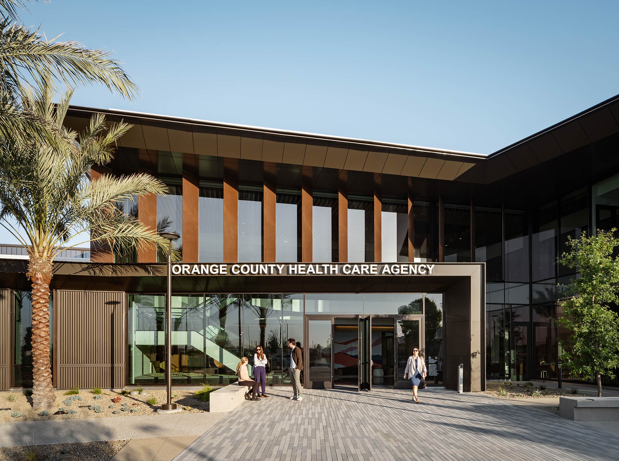 A building with people walking out front.