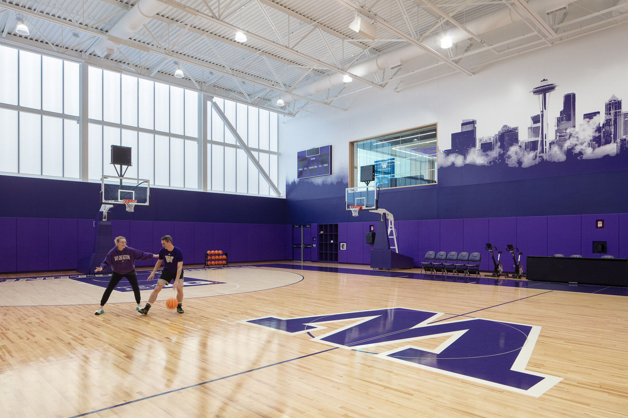 A group of people playing basketball.