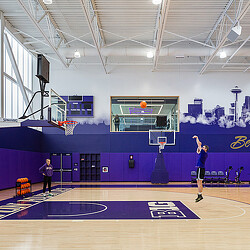 A person shooting a basketball.