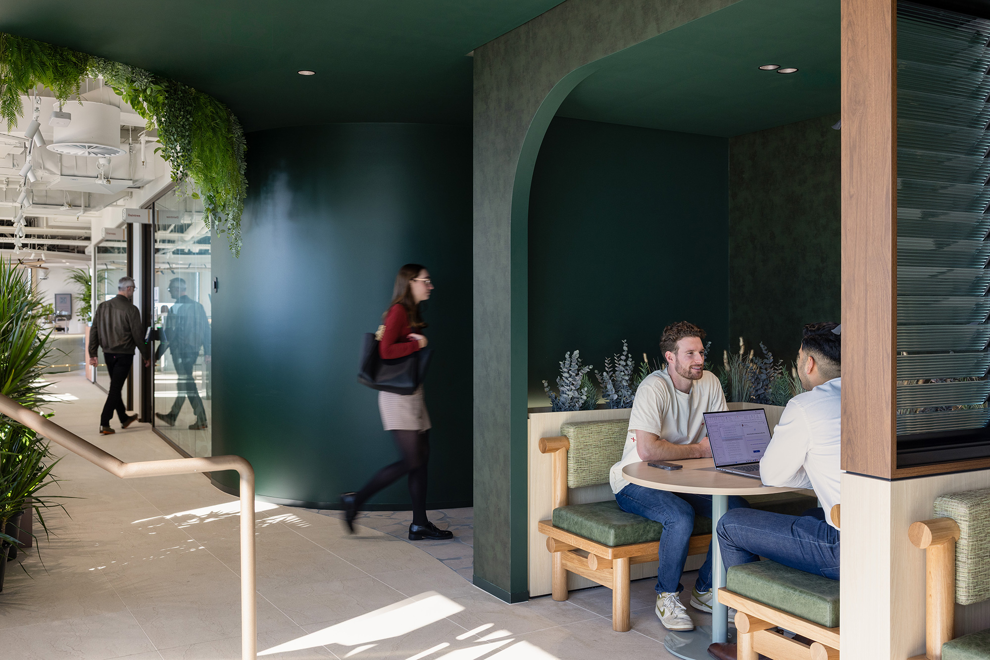 A group of people sitting in a room with a person standing in the front.