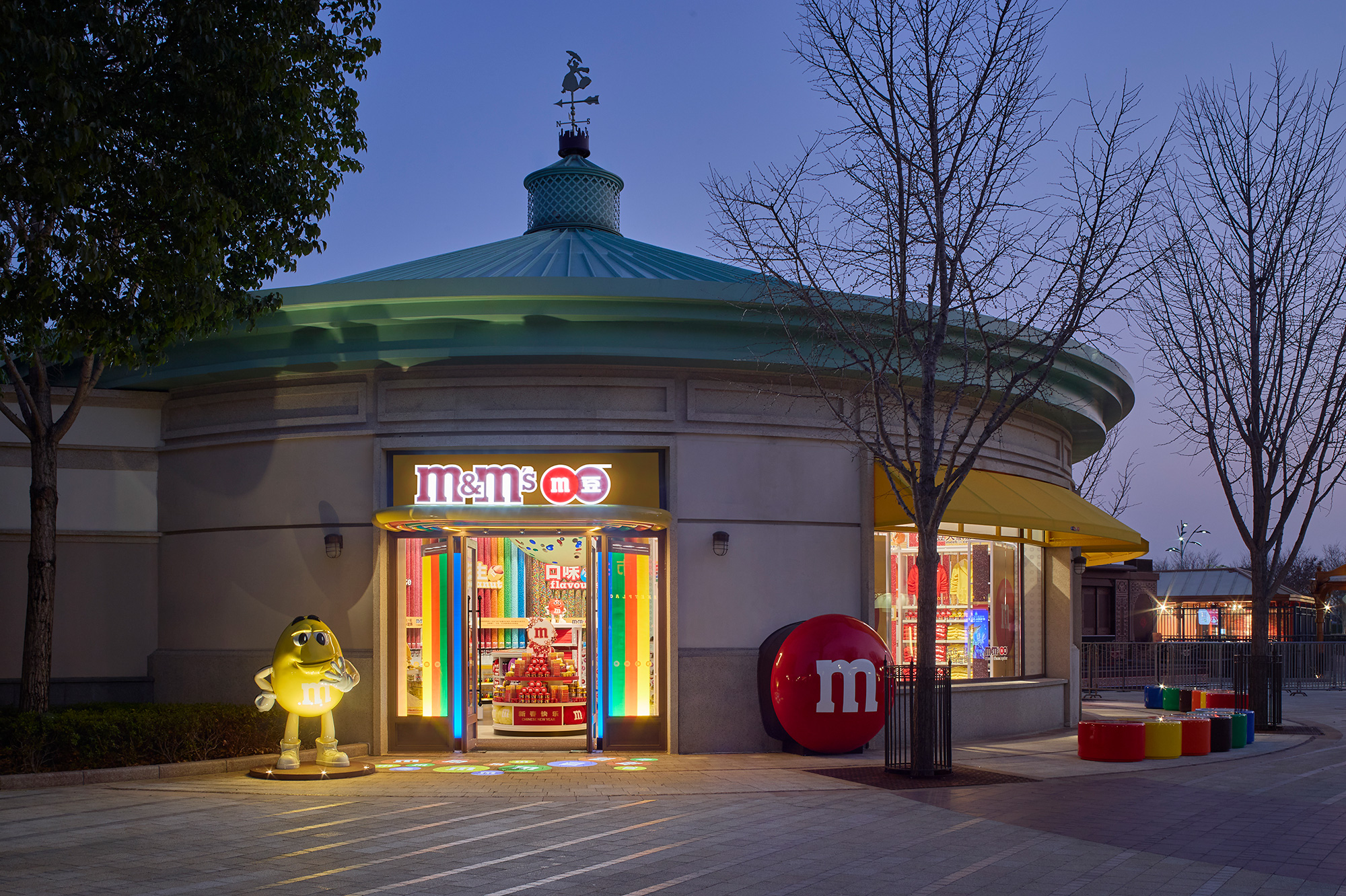 A store front with a green roof.