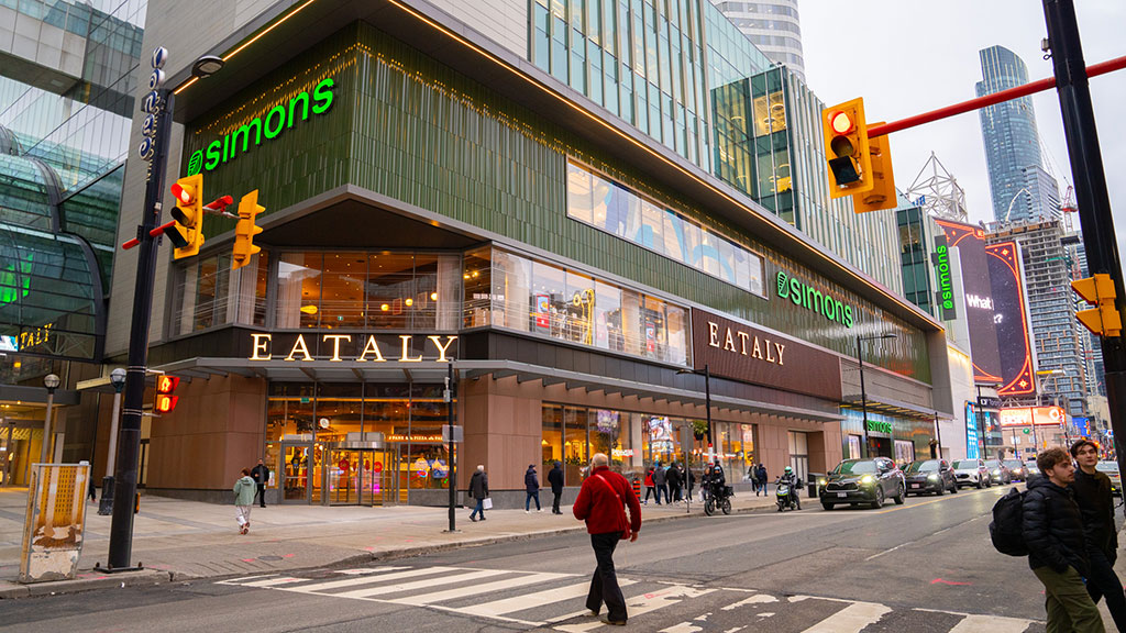A busy street with people and cars.