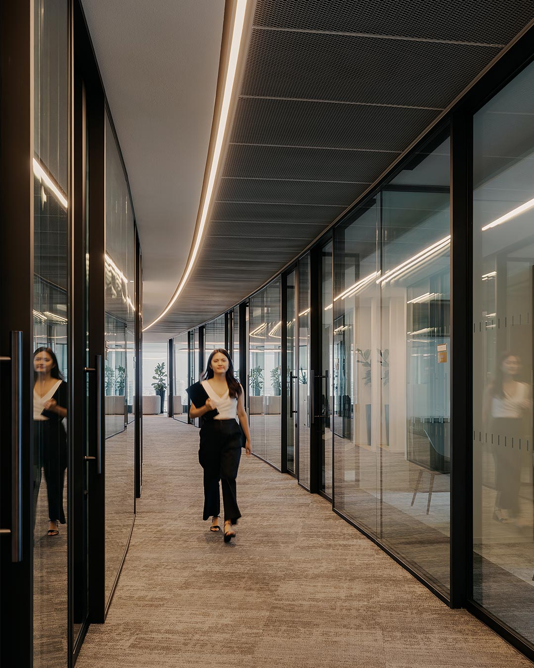 A man walking in a hallway.