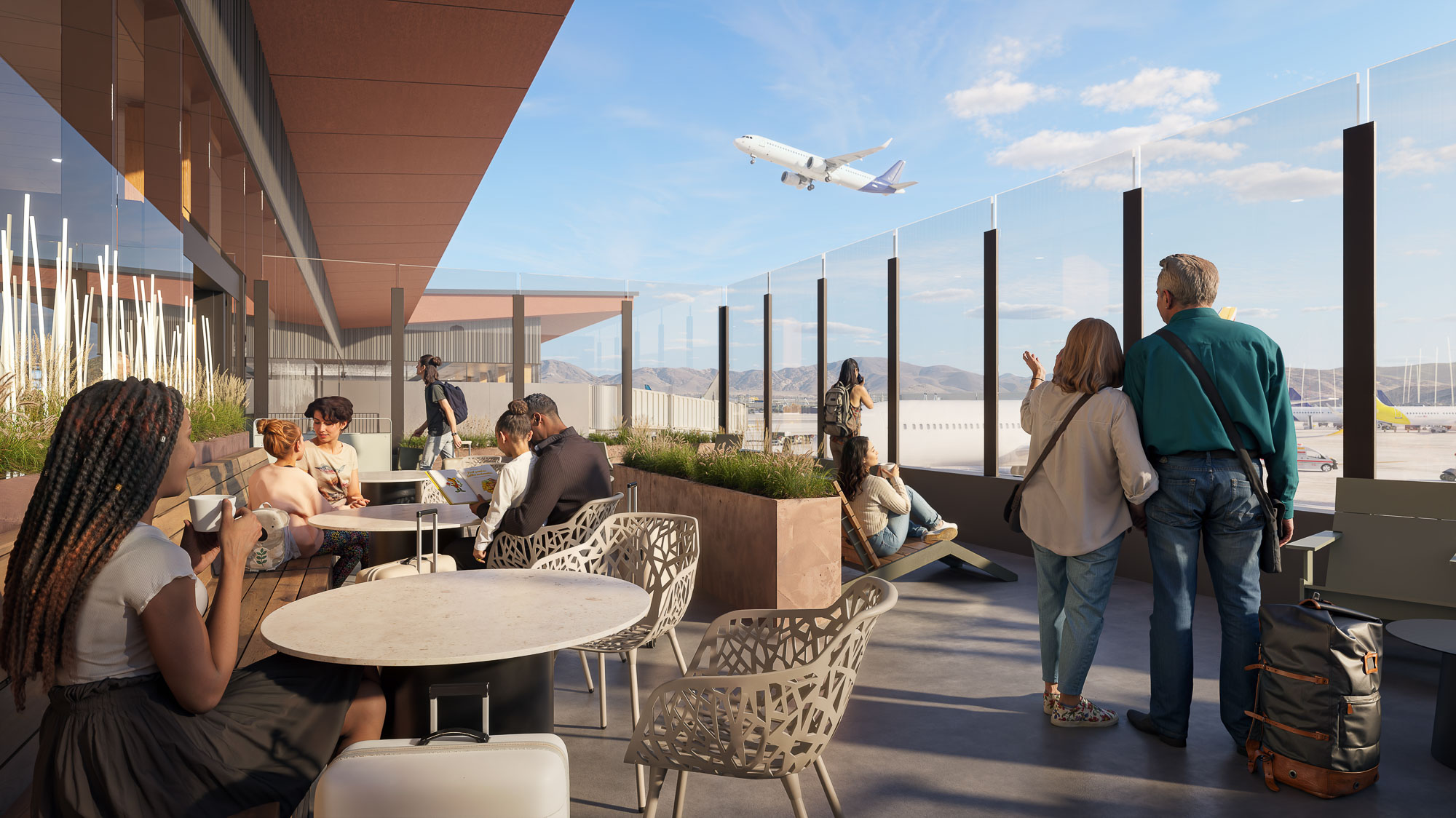 People sitting at tables watching an airplane fly by.
