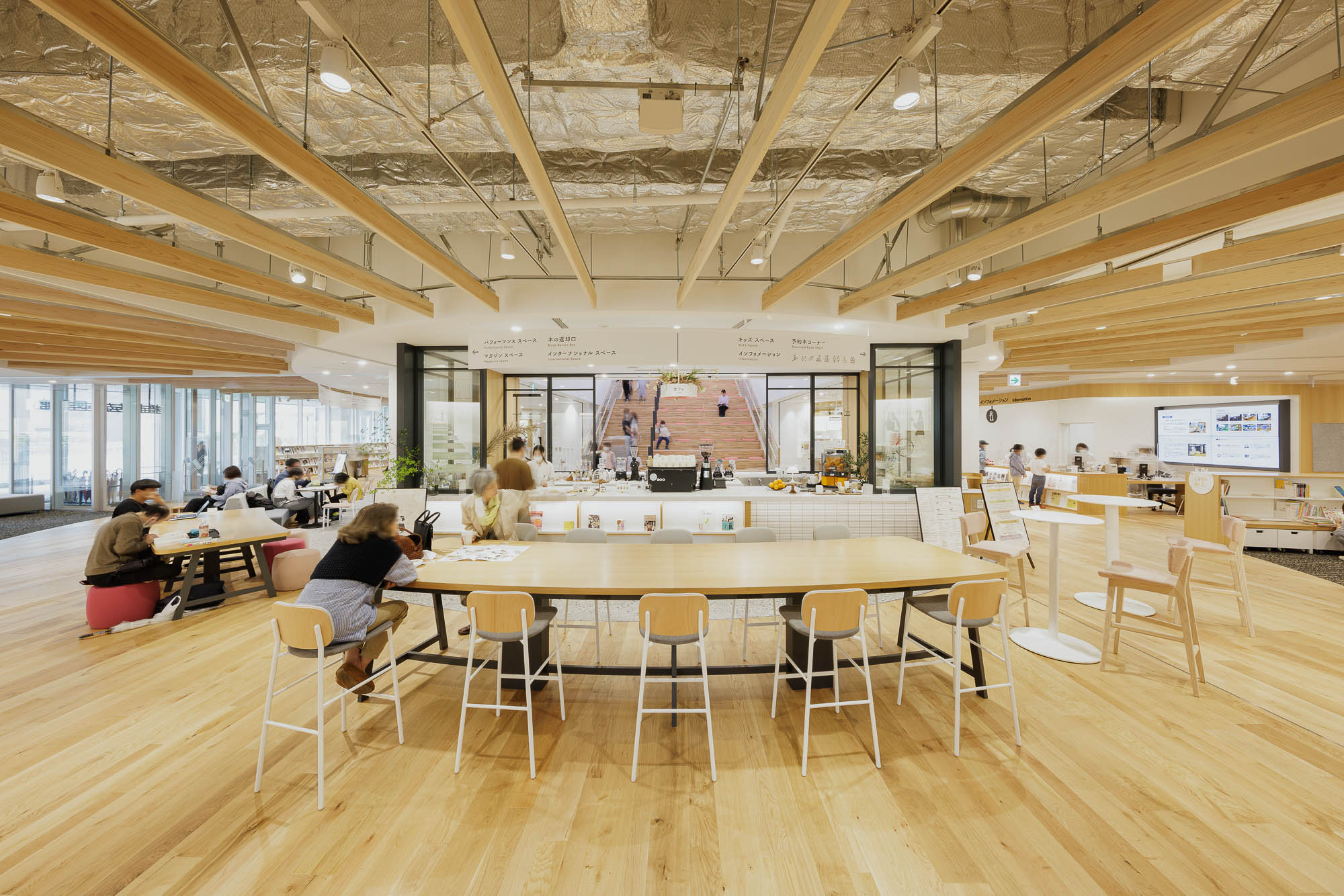 A group of people sitting at tables.