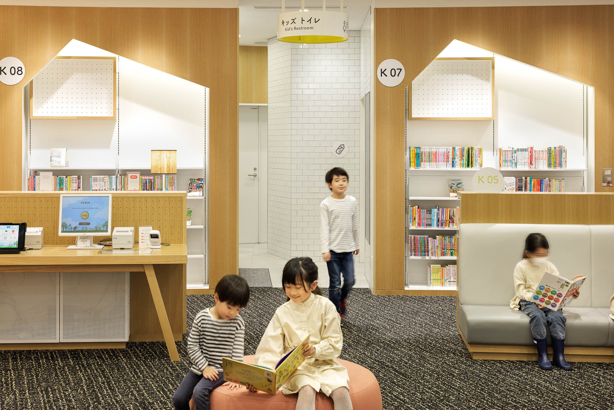 A group of people in a library.