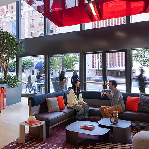 A man and woman sitting on a couch.