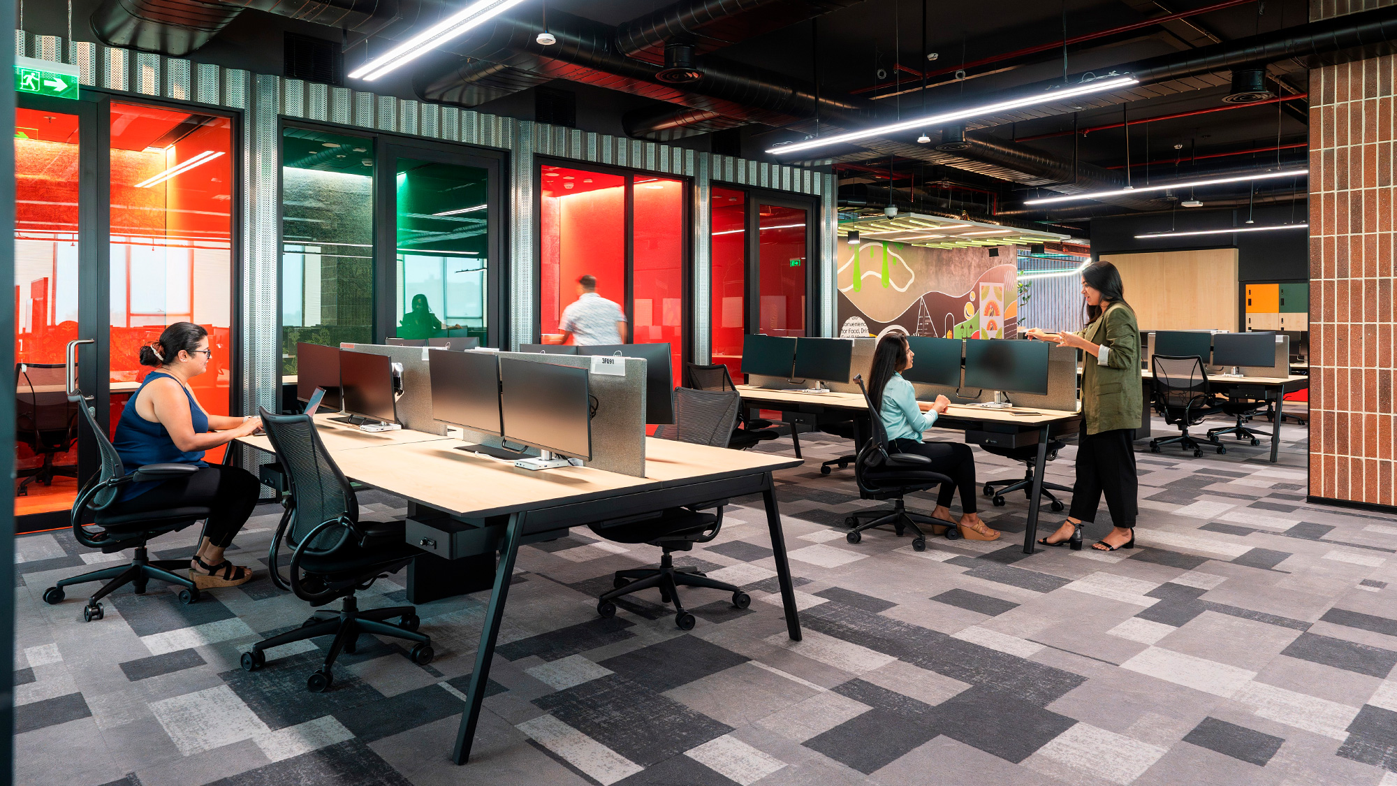 People sitting at tables in a room.