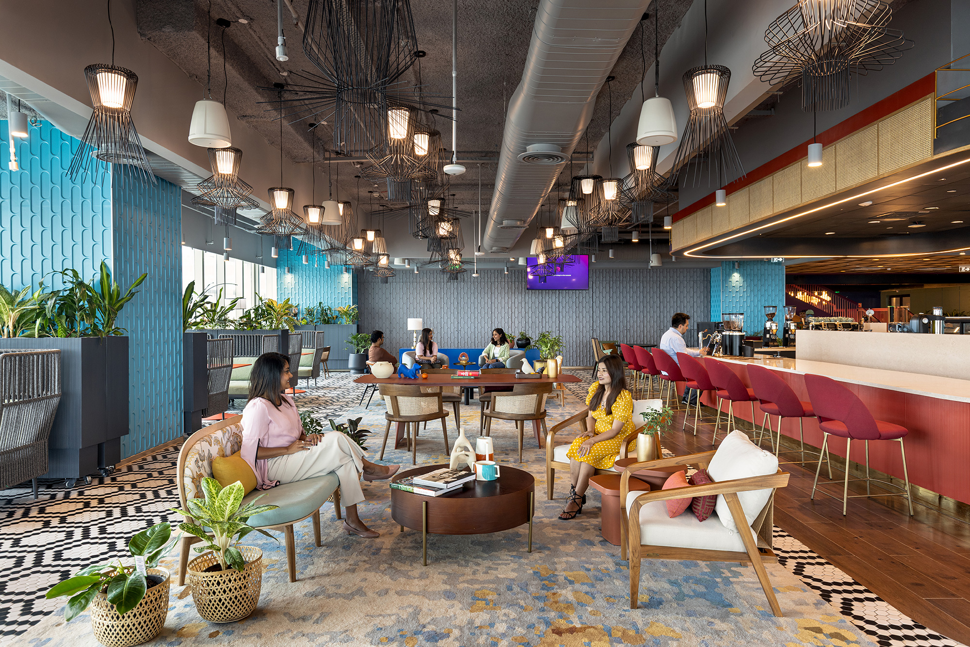 A group of people sitting at tables.