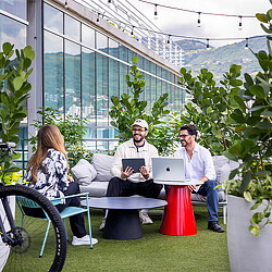 A group of people sitting outside.