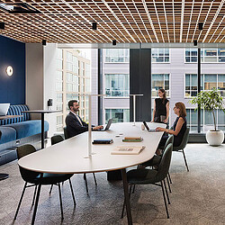 A group of people sitting around a table.