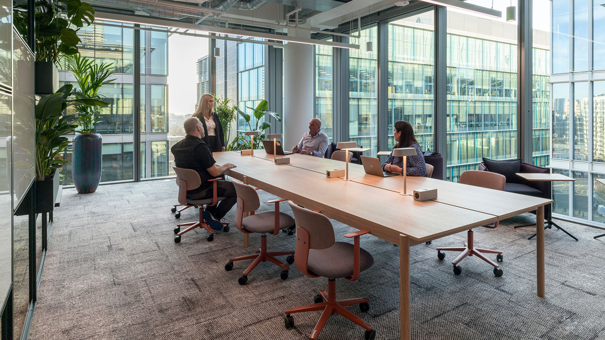 A group of people sitting around a table.