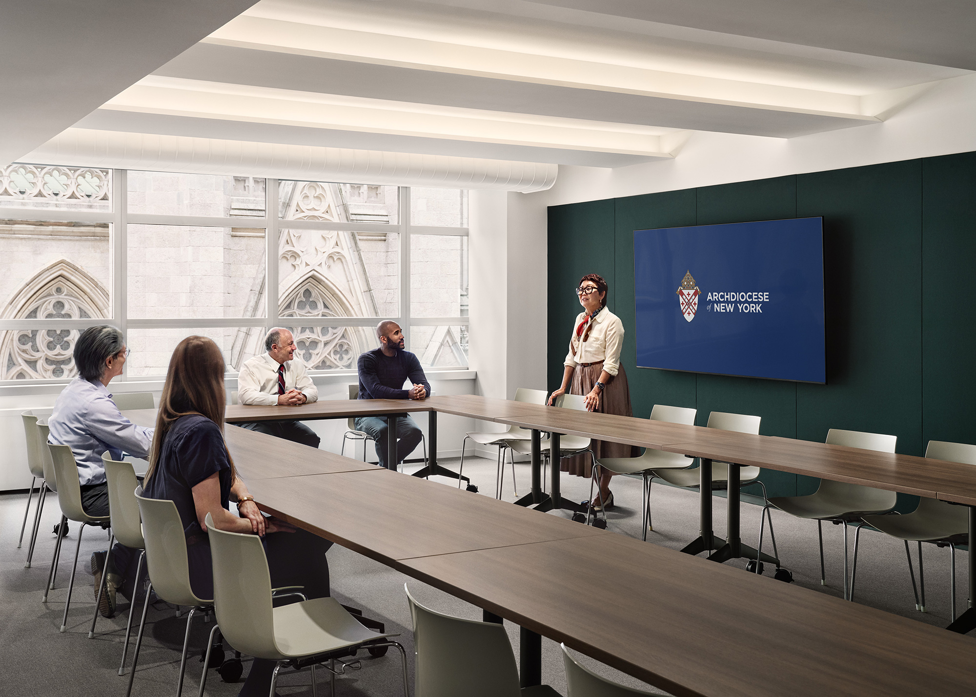 A group of people sitting at a table in a room.