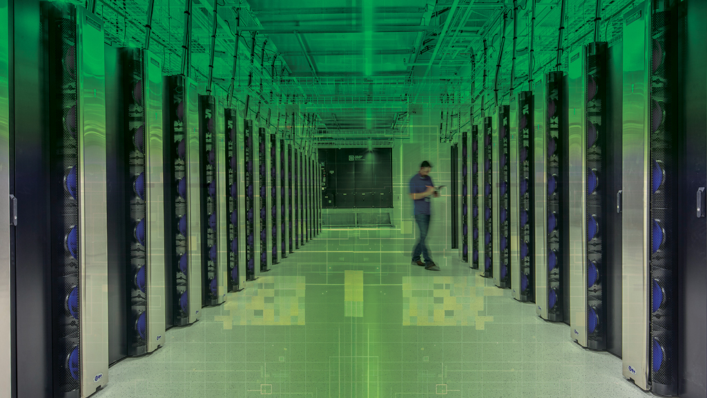 A person walking through a server room.
