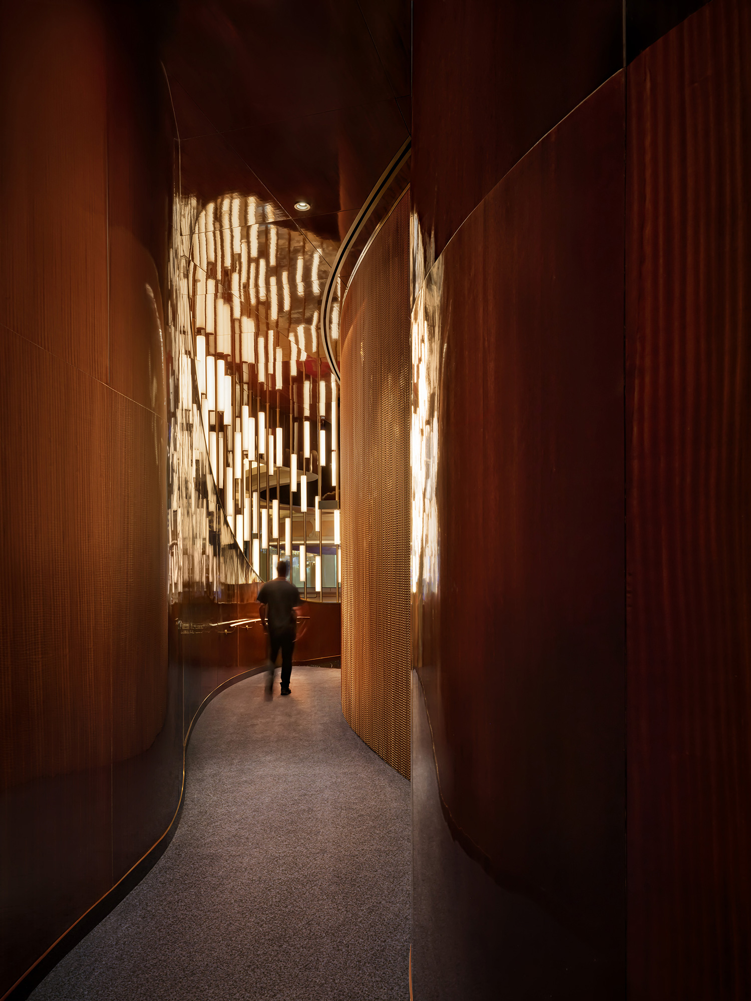 A person walking down a corridor.