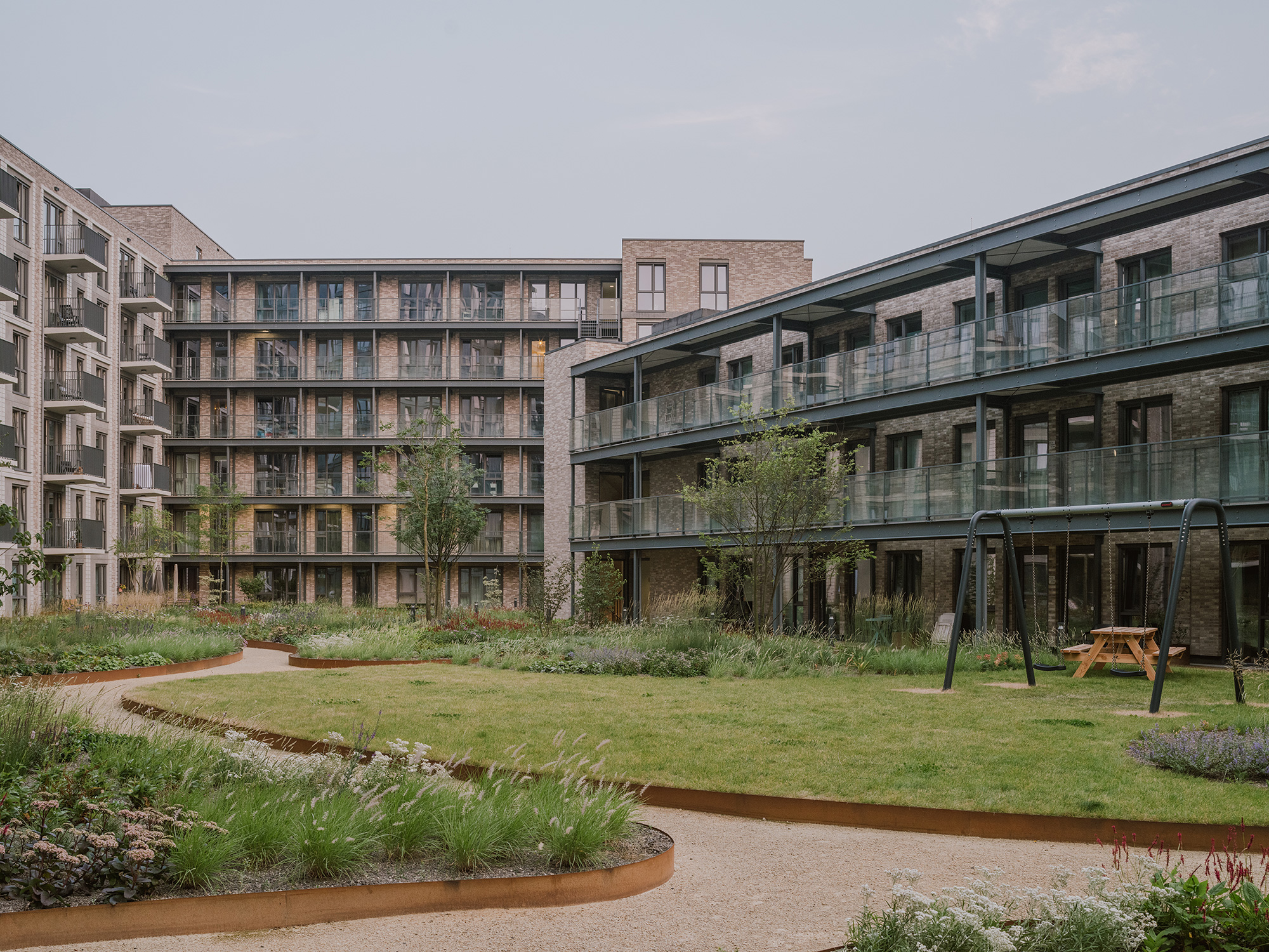 A building with a green lawn.