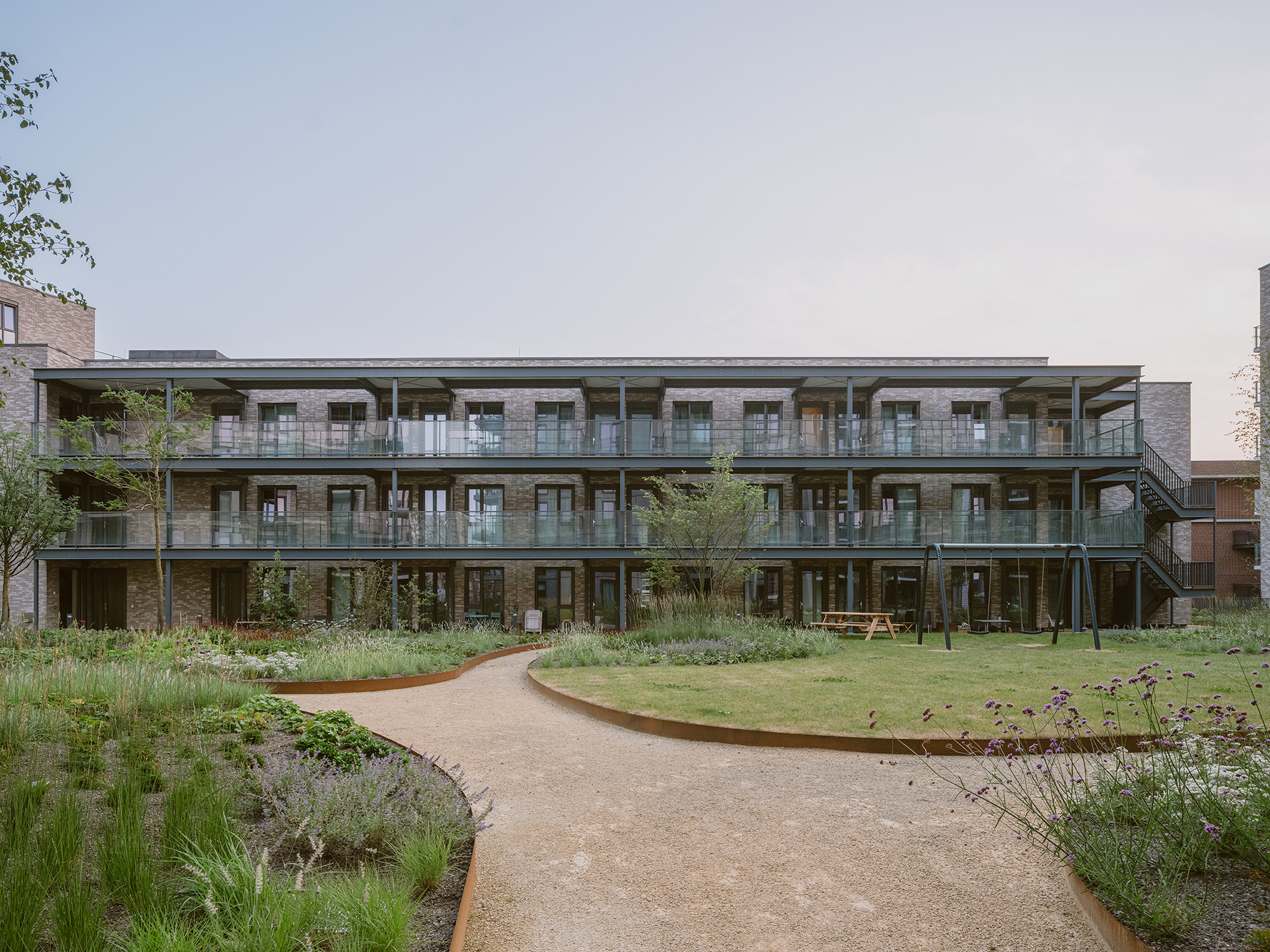 A building with a dirt road.